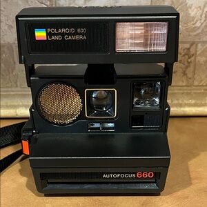 Polaroid 660 Autofocus Camera in Black with Gold Accents; used